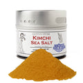 Kimchi sea salt in a round magnetic spice tin with flavorful red gourmet seasoning powder