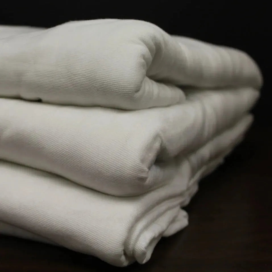 White cotton blend knitted fitted sheet and medical stretcher sheet with ceil blue accents — view 4