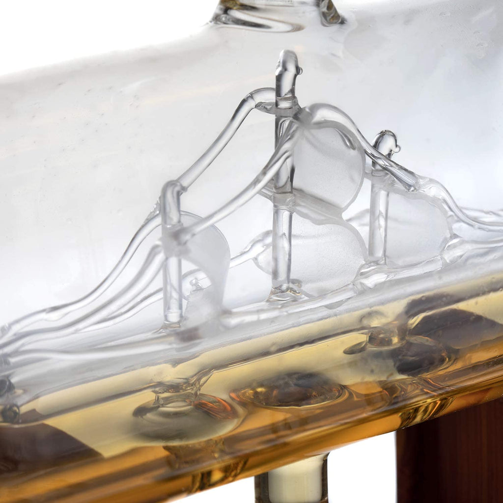 Hand-blown glass whiskey decanter with an antique ship inside, mahogany stand, and two glasses. — view 5
