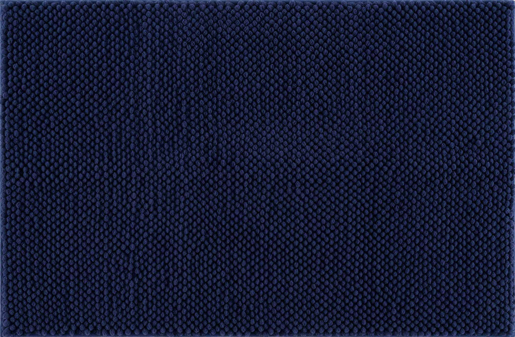 Plush navy blue washable bath mat with thick polyester shag texture on a bathroom floor — view 2