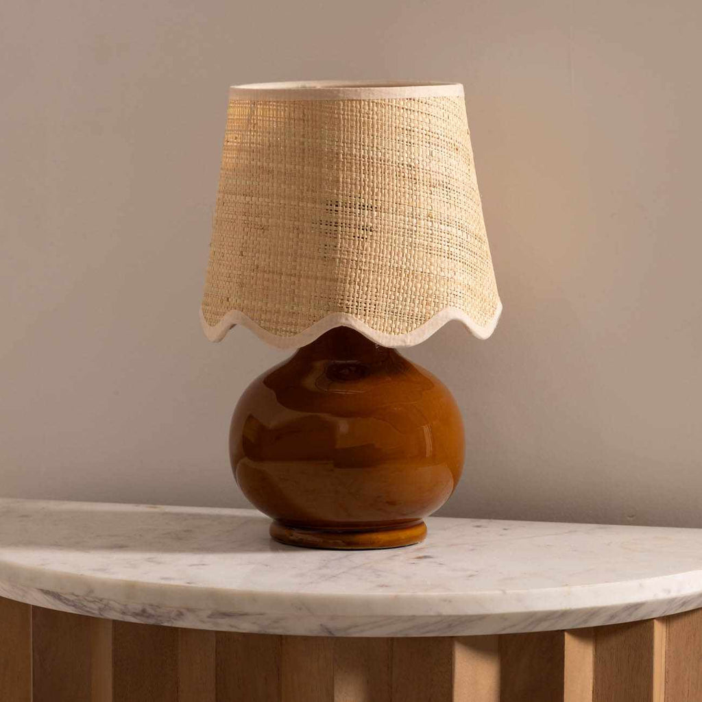 Wokila tan solid ceramic table lamp with a beige cotton shade and translucent base details