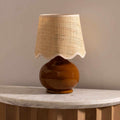 Wokila tan solid ceramic table lamp with a beige cotton shade and translucent base details