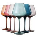 Six pastel colored crystal 20oz wine glasses featuring elegant stems in various muted tones