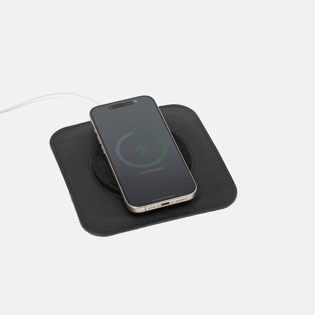 Minimalist Italian leather MagSafe charging rest station pad for smartphone organization