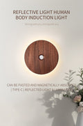 Rechargeable motion sensor night light mounted on a wall casting a warm ambient glow