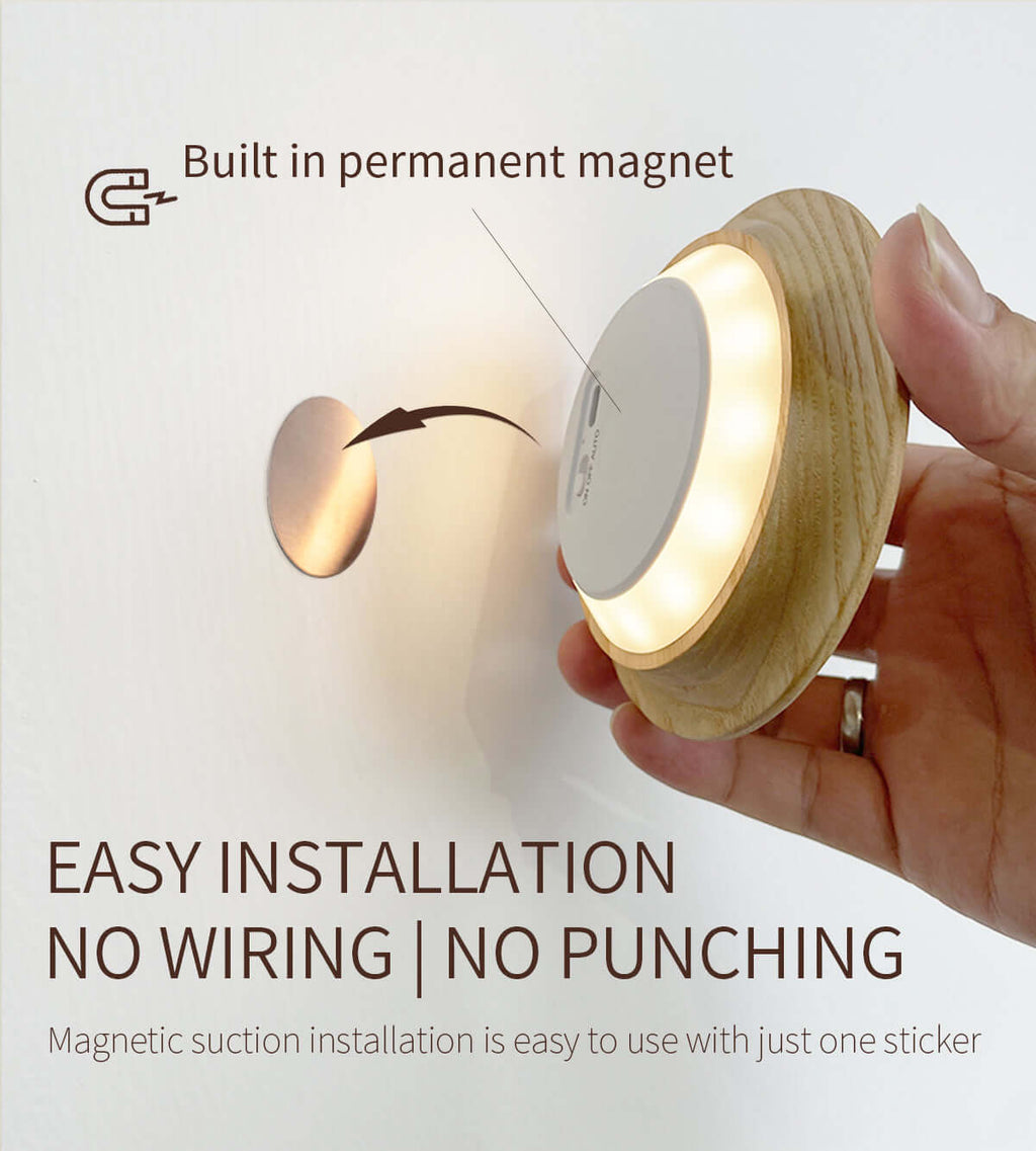 Rechargeable motion sensor night light mounted on a wall casting a warm ambient glow — view 5