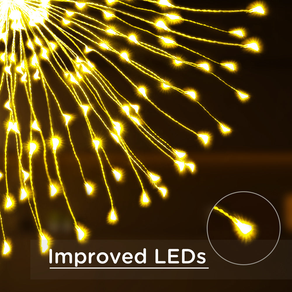 Warm white firework string lights arranged in a glowing starburst shape with flexible copper wire branches — view 2