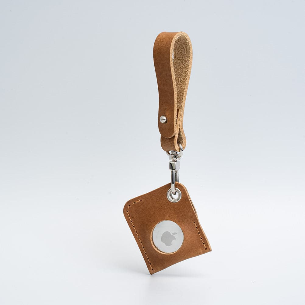 Leather AirTag bag charm attached to a metal ring, crafted from full-grain premium Italian leather — view 4