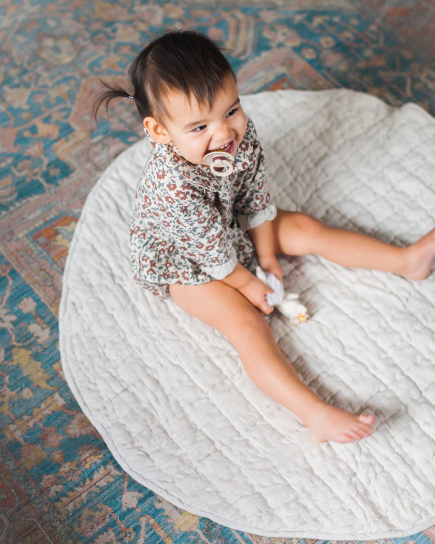 Stone washed linen quilted play mat in a neutral hue with thick, soft cotton filling — view 3