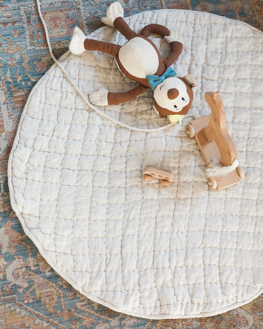 Stone washed linen quilted play mat in a neutral hue with thick, soft cotton filling — view 2