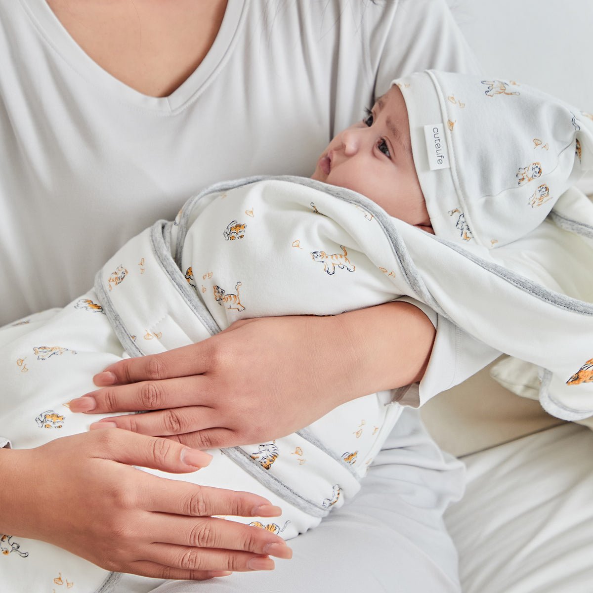 White cotton hooded baby swaddle wrap with delicate tiger embroidery and extra warm padding — view 2