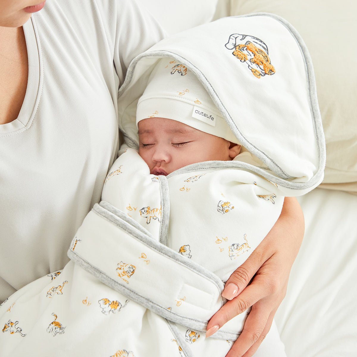 White cotton newborn baby swaddle wrap featuring a cute lively tiger print and hooded design — view 2