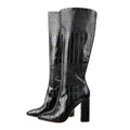 Black croc-embossed faux leather knee-high boots featuring a square toe and thick block heel.