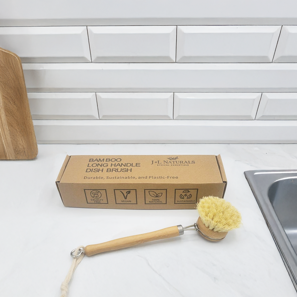 Bamboo long handle dish brush with natural sisal bristles on a kitchen counter — view 3