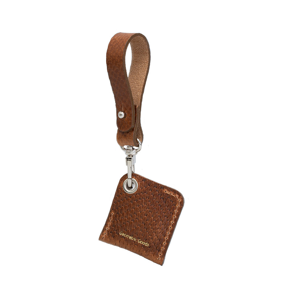 Leather AirTag bag charm attached to a metal ring, crafted from full-grain premium Italian leather — view 2