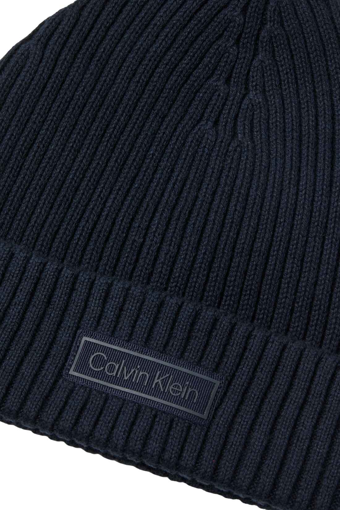 Men's black ribbed knit Calvin Klein beanie with a front logo patch and folded cuff — view 6