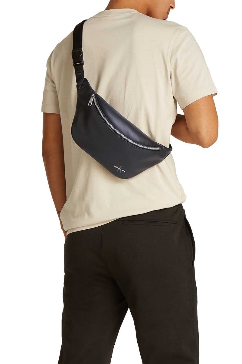 Men's black faux-leather bum bag with adjustable strap and embossed designer logo on the front — view 7