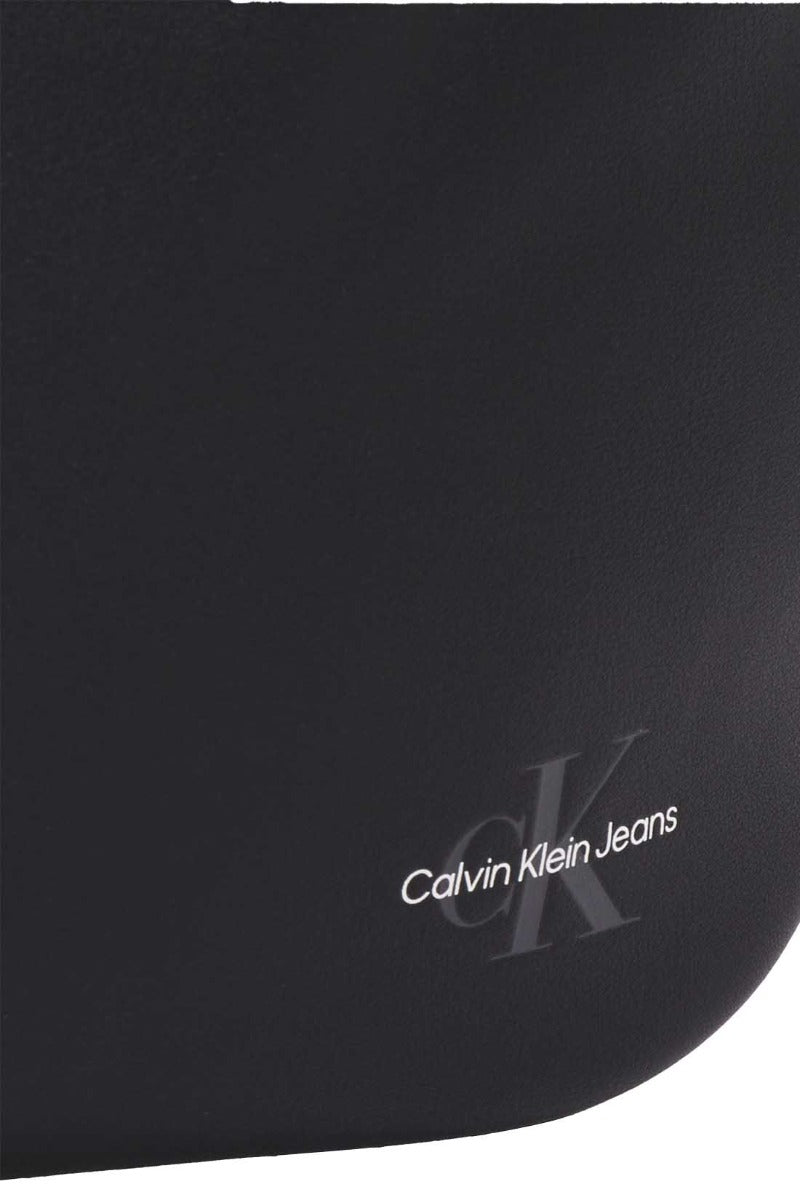 Men's black faux-leather bum bag with adjustable strap and embossed designer logo on the front — view 4