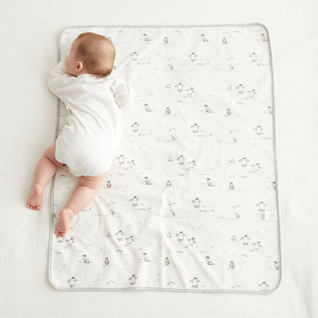 Waterproof baby changing mat in crisp white, lightweight portable pad for newborn diaper changes