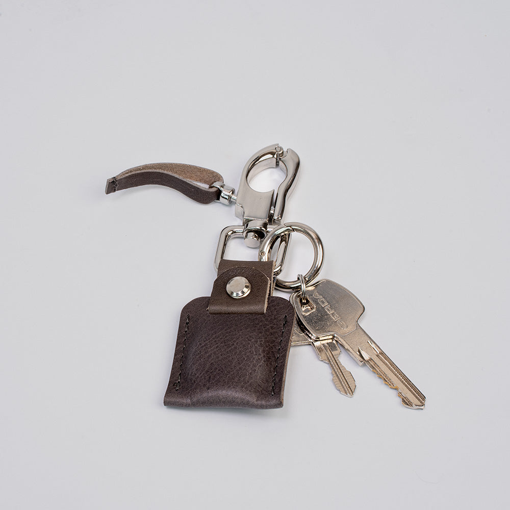 Premium full-grain Italian leather AirTag keychain with snap hook and metal keyring