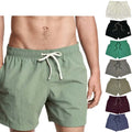 Tom men's swim shorts with elastic waistband, side pockets, and breathable mesh lining