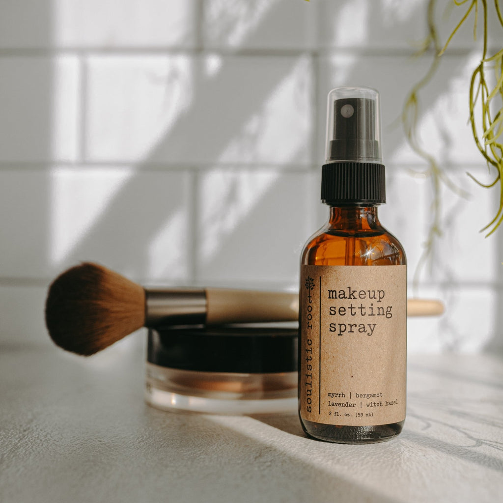 Natural makeup setting spray in a 2oz travel bottle with a fine mist applicator.