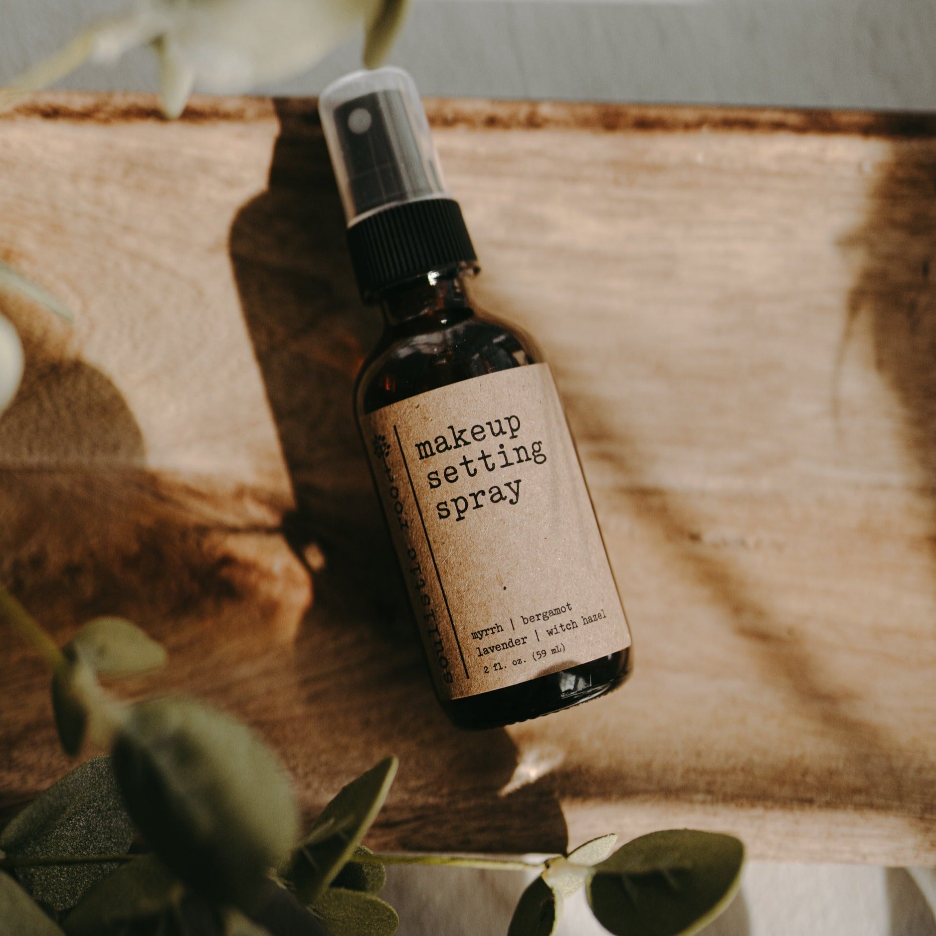 Natural makeup setting spray in a 2oz travel bottle with a fine mist applicator. — view 2