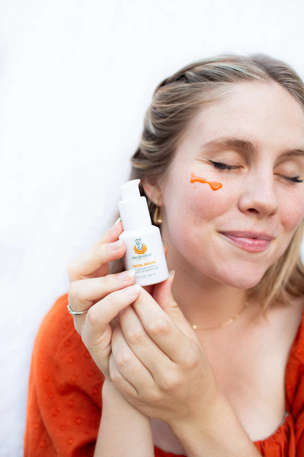 Illuminating face serum bottle with natural brightening Ayurvedic botanical ingredients for a healthy radiant glow