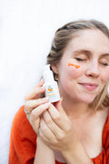 Illuminating face serum bottle with natural brightening Ayurvedic botanical ingredients for a healthy radiant glow