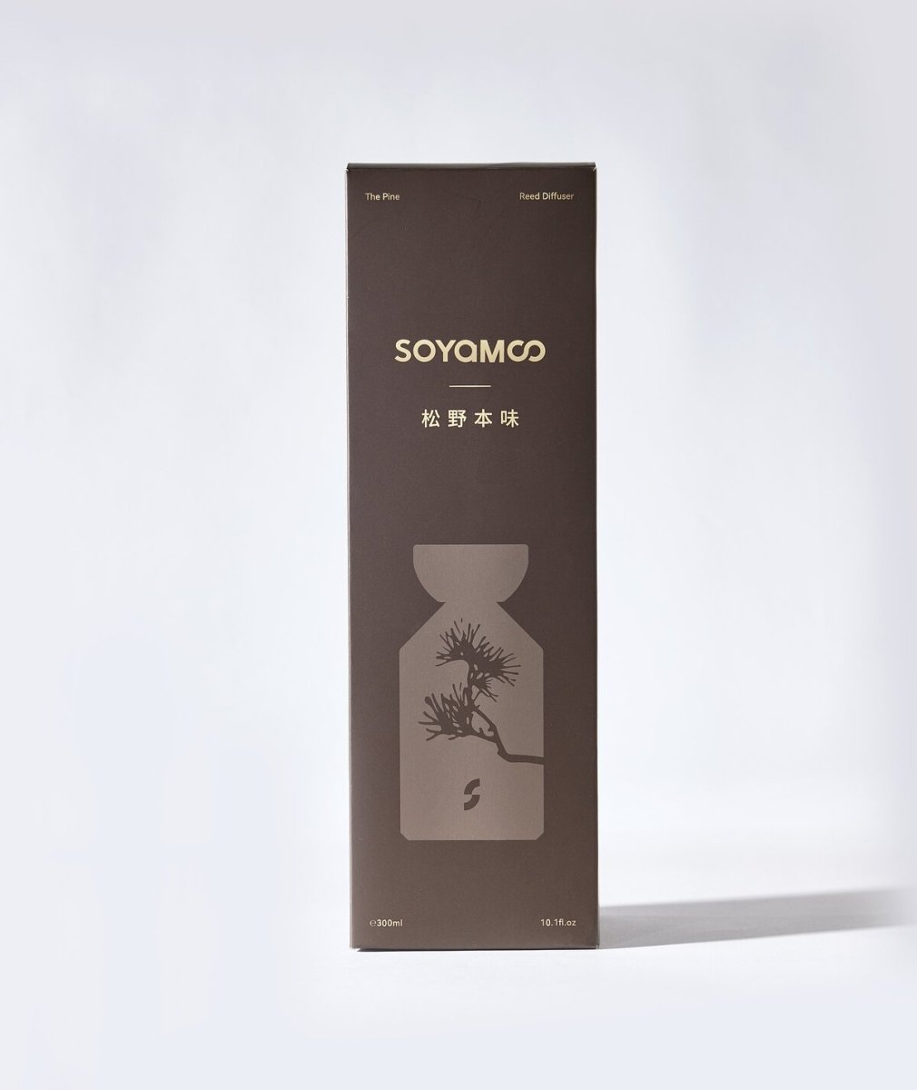 Warm brown angled shoulder glass reed diffuser with wooden cap and luxury woody fragrance — view 5
