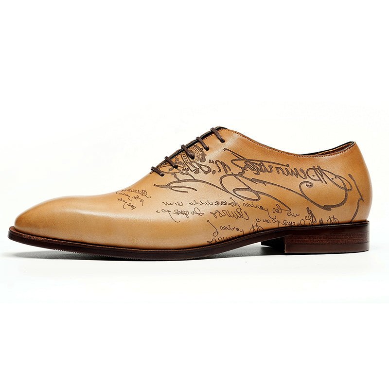 Polished men's calfskin Oxford shoes featuring artistic script engraving on the leather upper