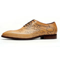 Polished men's calfskin Oxford shoes featuring artistic script engraving on the leather upper