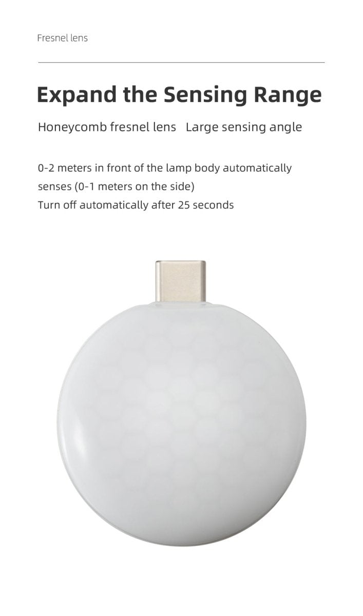 Mini portable wireless smartphone light with warm LED illumination plugged into a mobile phone — view 2