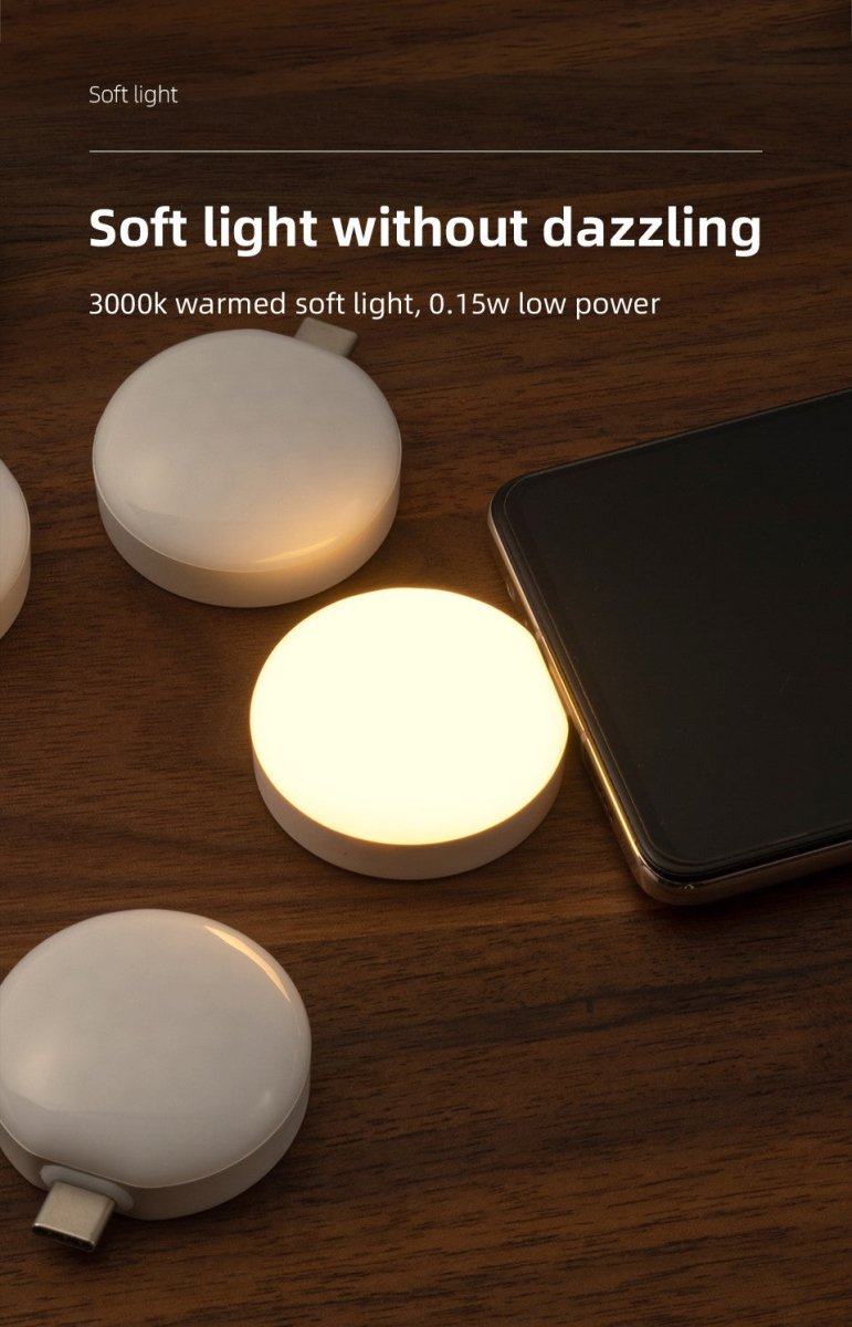 Mini portable wireless smartphone light with warm LED illumination plugged into a mobile phone — view 4