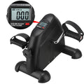 Compact black mini exercise bike with pedals and resistance dial for home or office workout