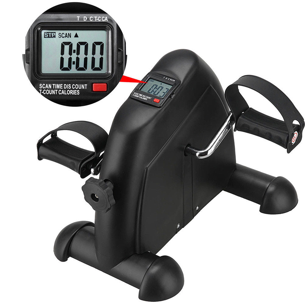 Compact black mini exercise bike with pedals and resistance dial for home or office workout