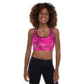 Pink padded sports bra with scoop neckline racerback design and moisture wicking stretch fabric