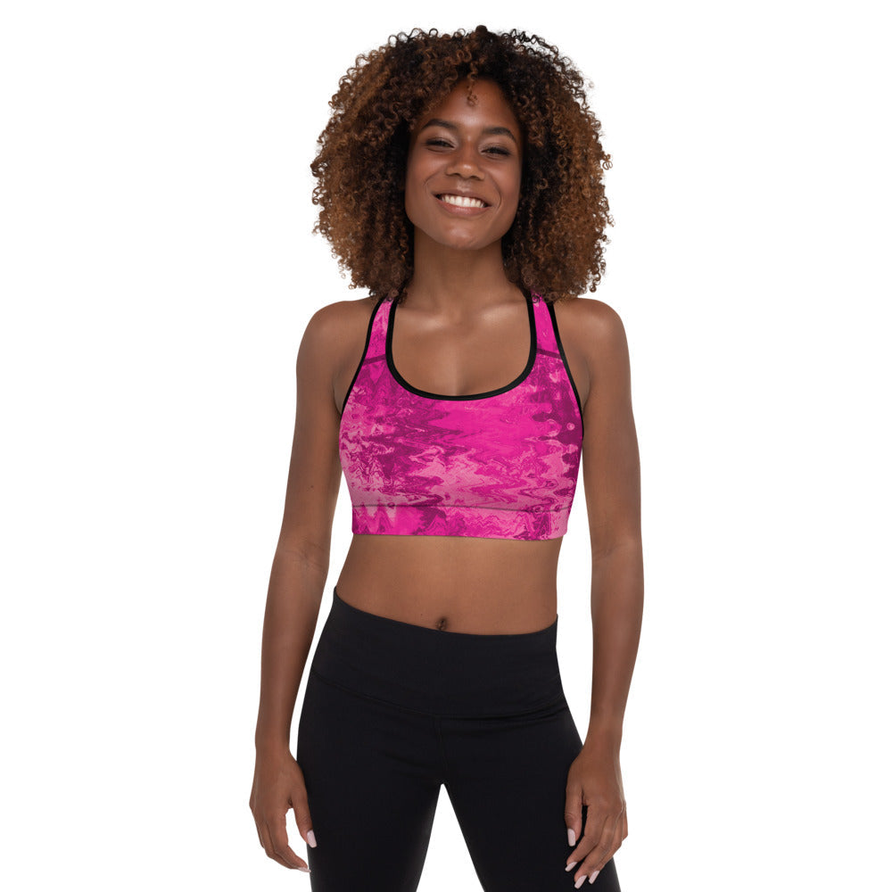 Pink padded sports bra with scoop neckline racerback design and moisture wicking stretch fabric