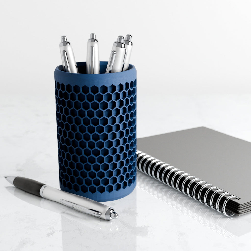Modern geometric honeycomb pencil holder organizing pens and accessories on a stylish office desk setup. — view 2