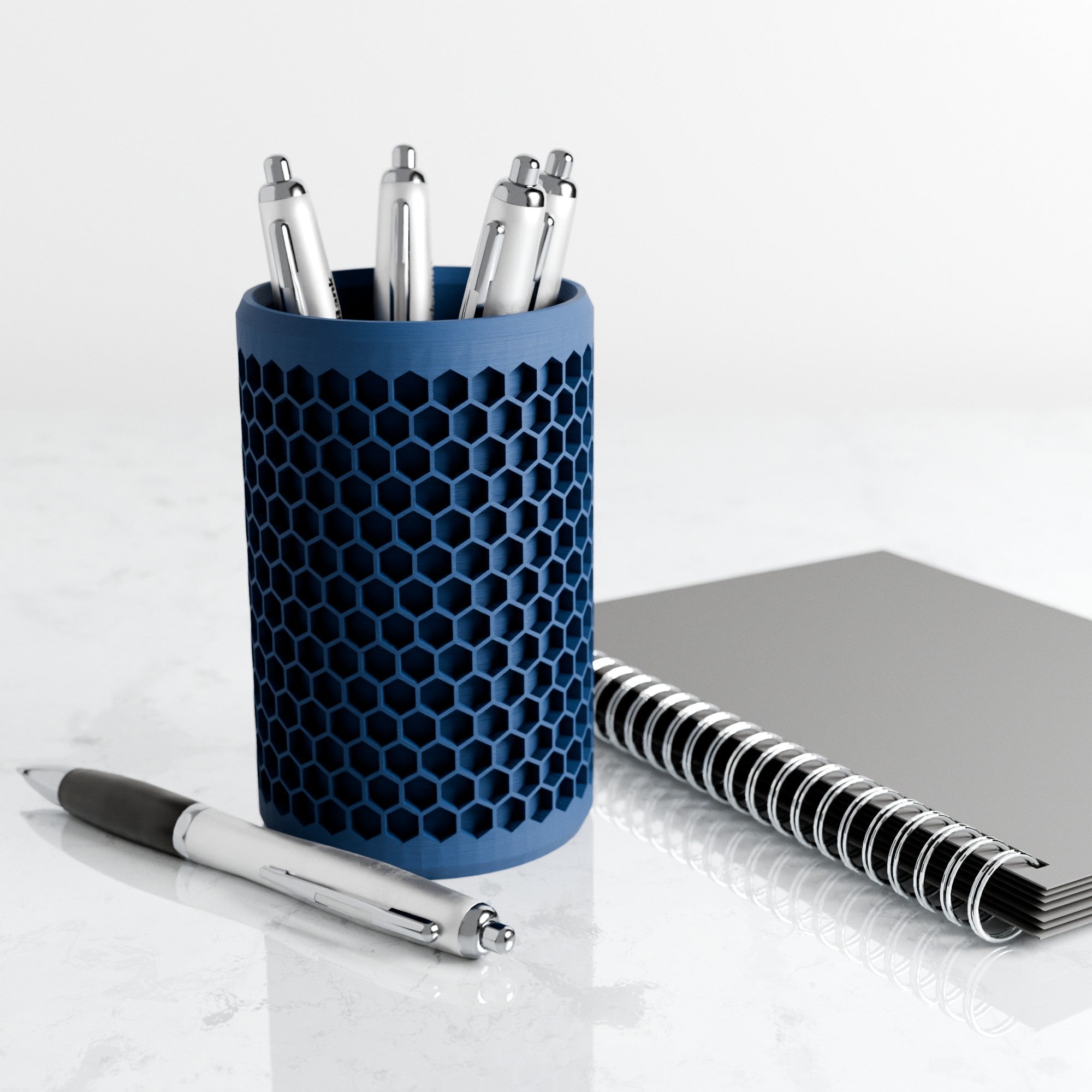 Modern geometric honeycomb pencil holder organizing pens and accessories on a stylish office desk setup. — view 2