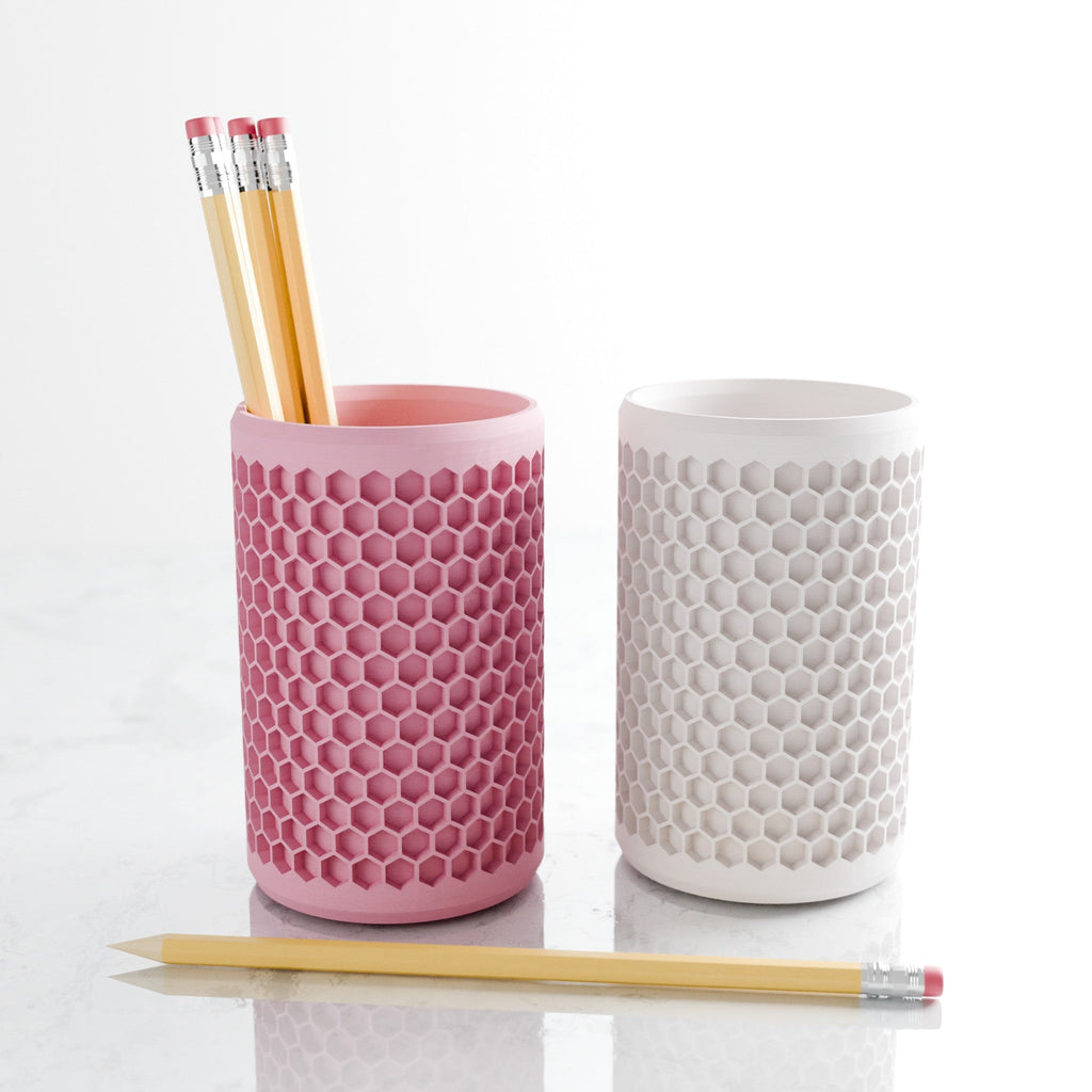 Modern geometric honeycomb pencil holder organizing pens and accessories on a stylish office desk setup. — view 5