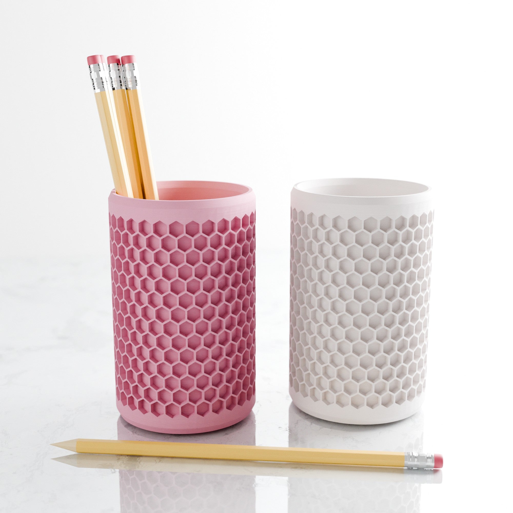 Modern geometric honeycomb pencil holder organizing pens and accessories on a stylish office desk setup. — view 5