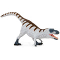 Nanuqsaurus toy dinosaur figure with white feathers and blue-gray skin in a dynamic standing pose