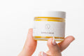 Natural nipple balm in 2 oz jar with reusable cotton bag for soothing breastfeeding relief