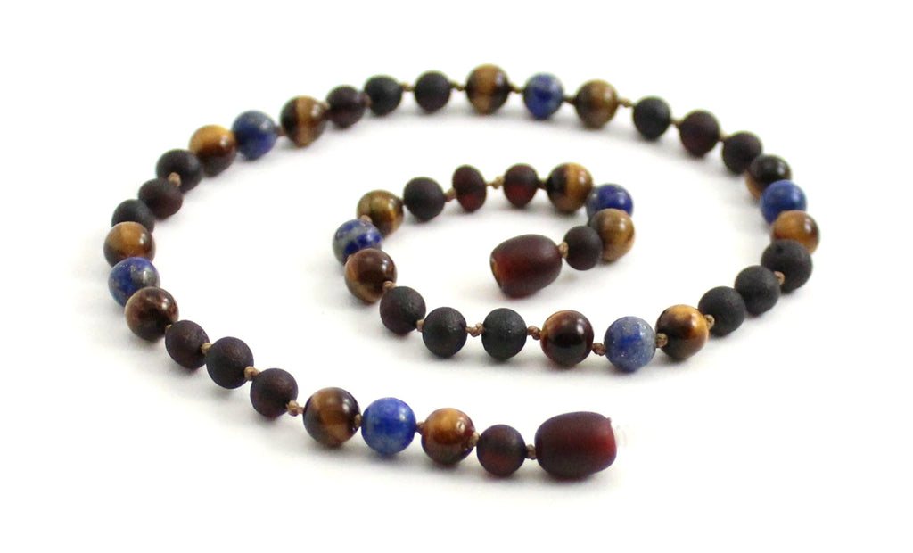 Gemstone necklace featuring raw cherry amber, lapis lazuli, and brown tiger eye beads.