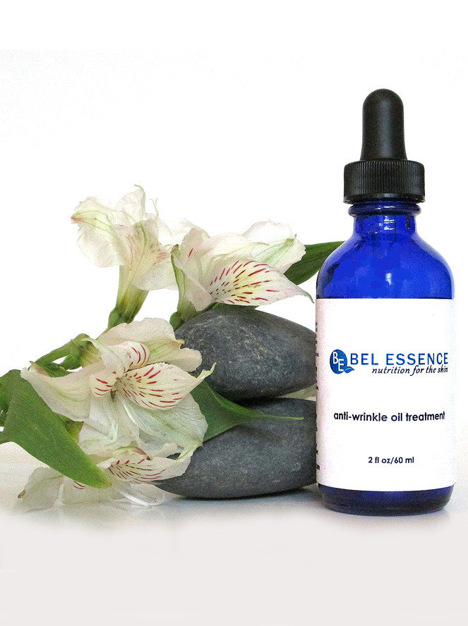 Two ounce bottle of natural anti-aging face serum with botanical oils and plant extracts. — view 5