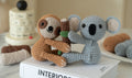 Amigurumi sloth and koala DIY crochet kit with yarn, hook, stuffing, and instruction brochure
