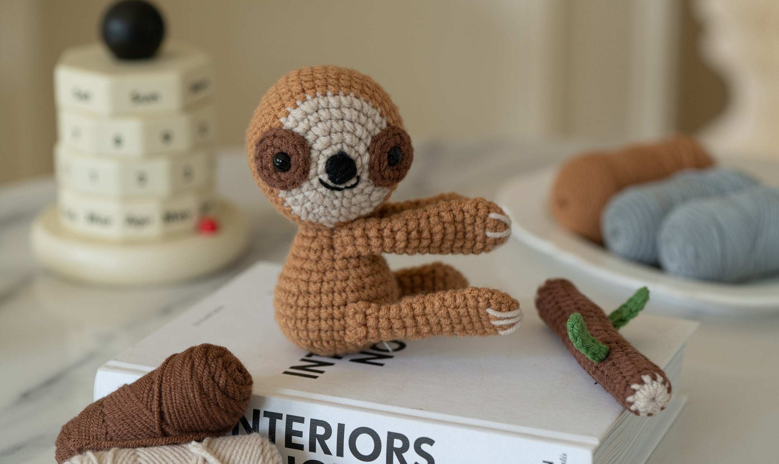 Amigurumi sloth and koala DIY crochet kit with yarn, hook, stuffing, and instruction brochure — view 2