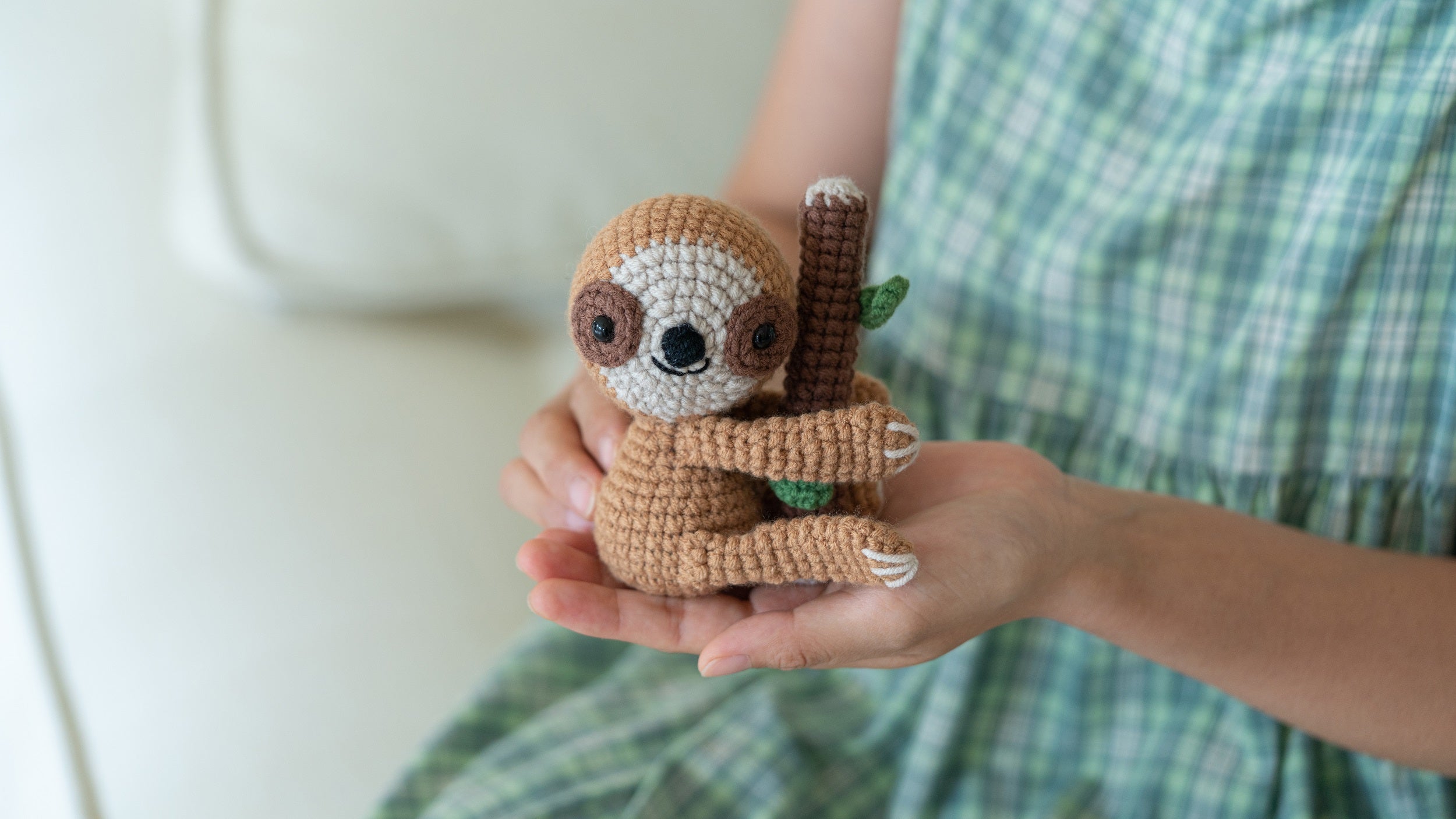 Amigurumi sloth and koala DIY crochet kit with yarn, hook, stuffing, and instruction brochure — view 4