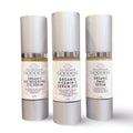 Three full-size organic anti-aging face and eye serums in dropper bottles for daily skincare